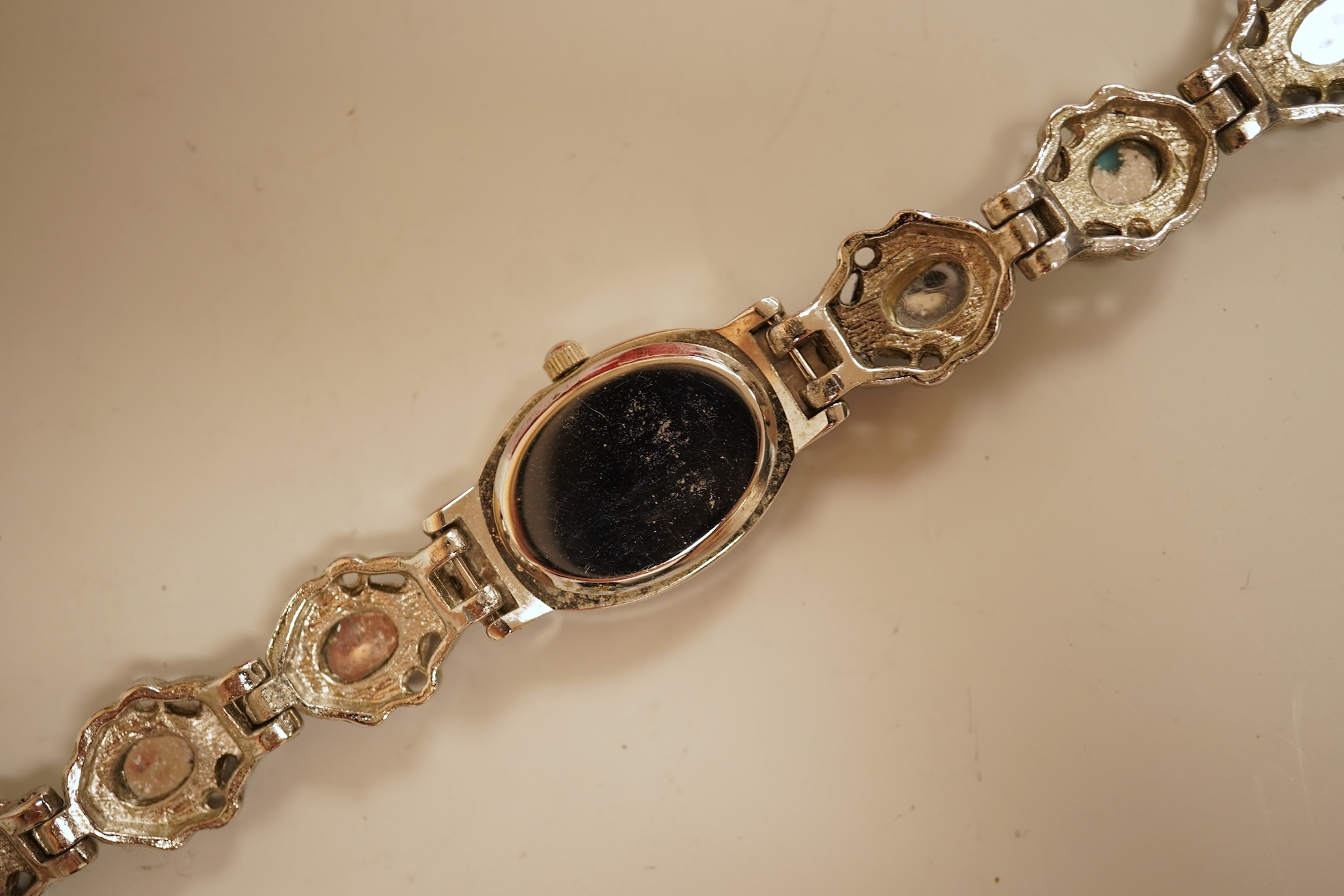 A small collection of assorted costume jewellery and other items including a cut steel shoe buckle, bracelets, chains, pair of silver and enamel oval cufflinks, etc.